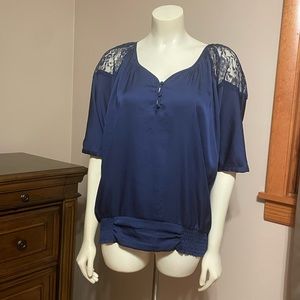 Express lace shoulder dressy top. Color blue w padded button detail in front.